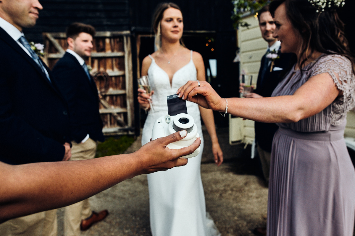 Instant camera at wedding at Great Barn in Rolvenden Kent