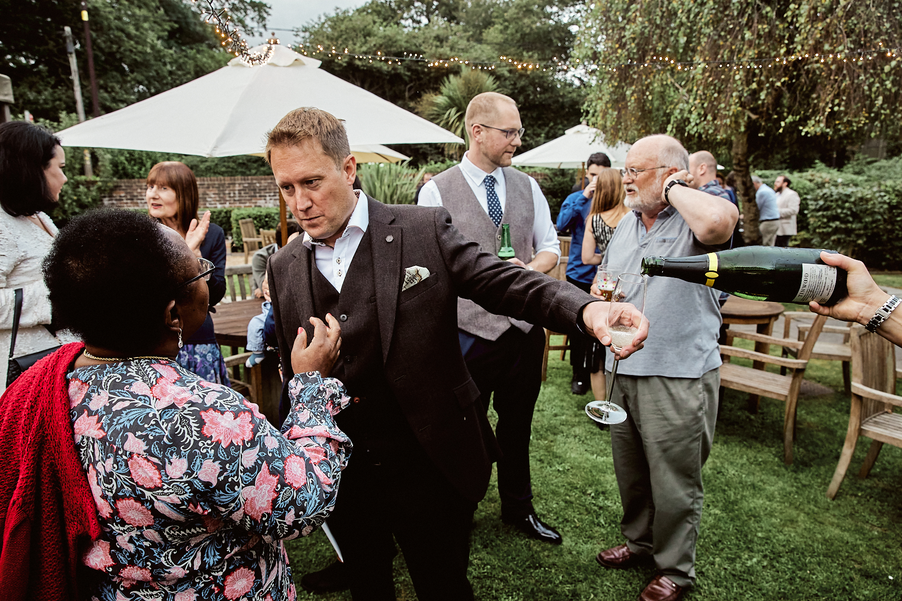 Funny photo of groom drinking champagne at Welldiggers arms wedding Petworth West Sussex